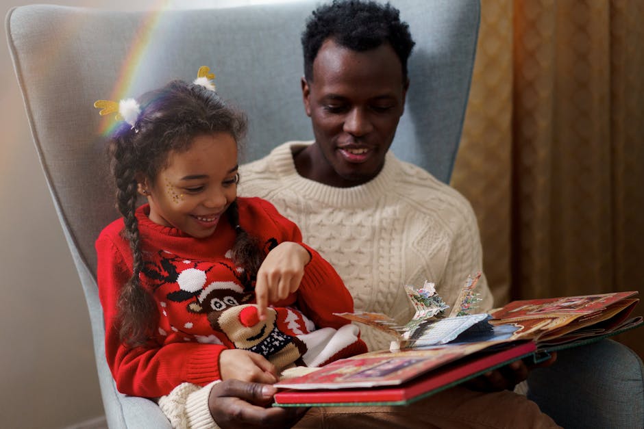 A father and daughter share a joyful moment reading a Christmas storybook indoors.