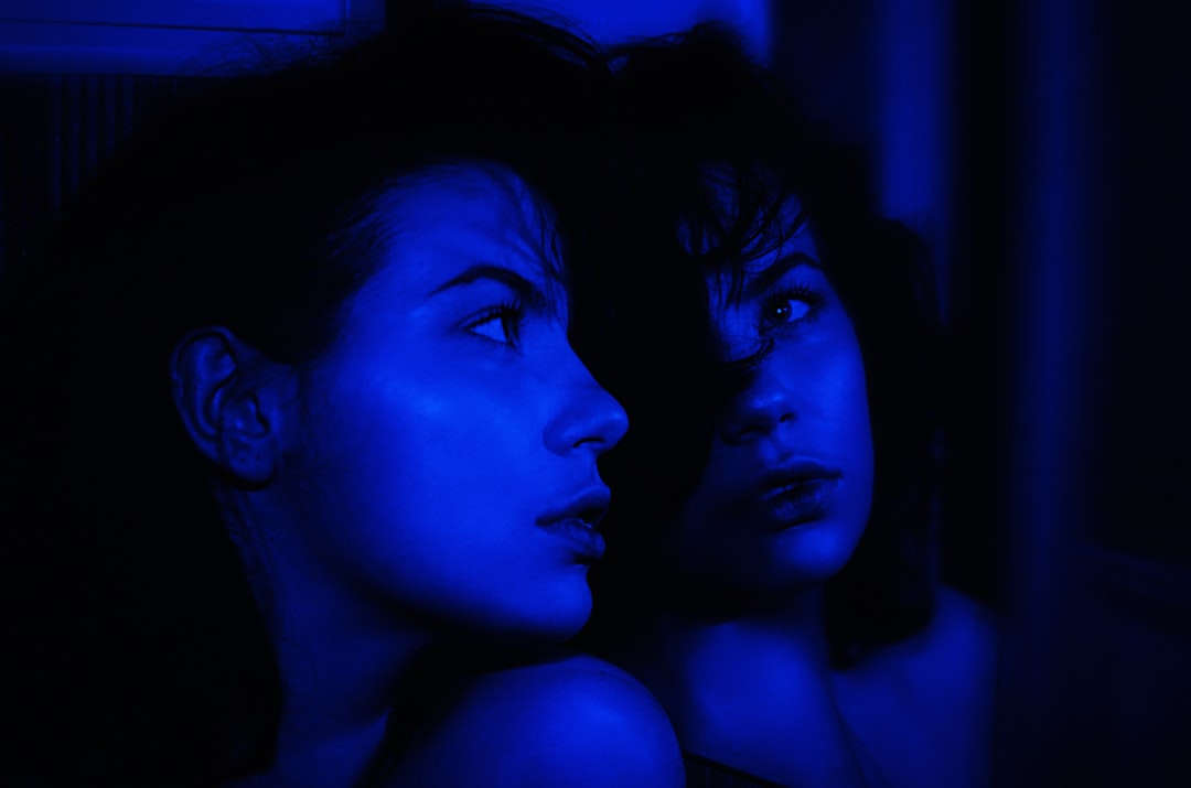 a couple of women sitting next to each other