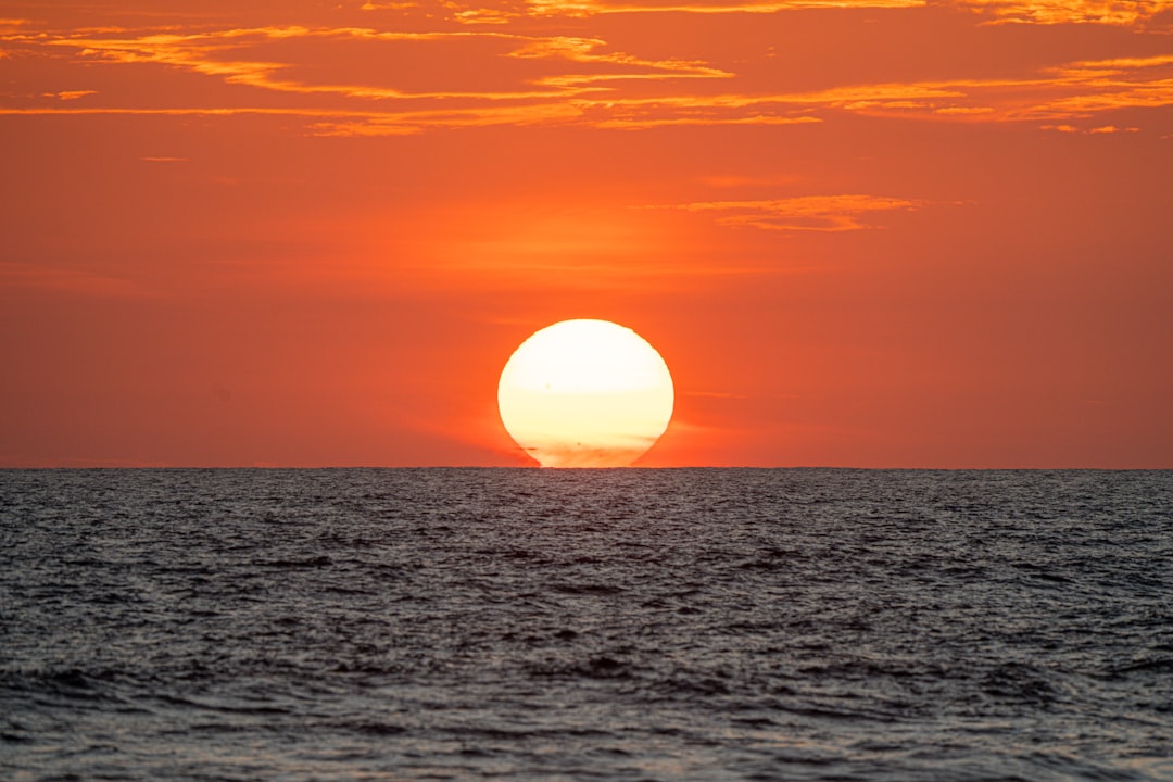 Vibrant sunset over a calm ocean horizon