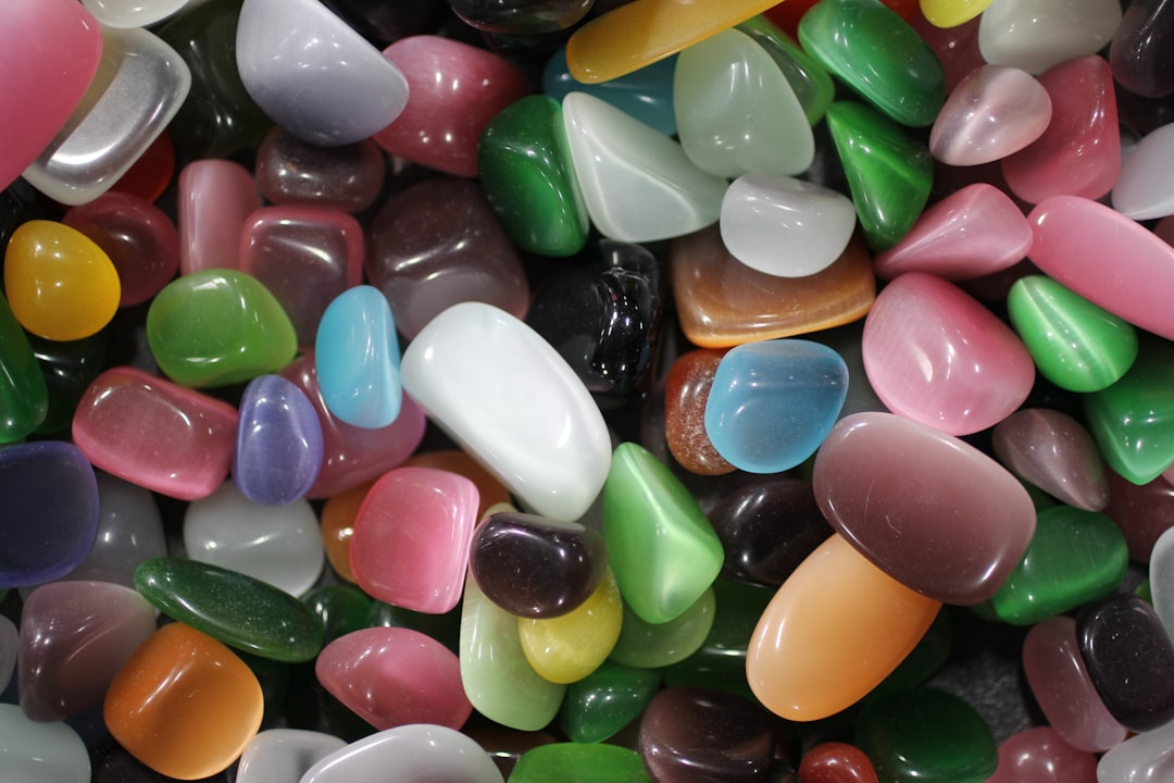 a close up of a pile of colorful rocks